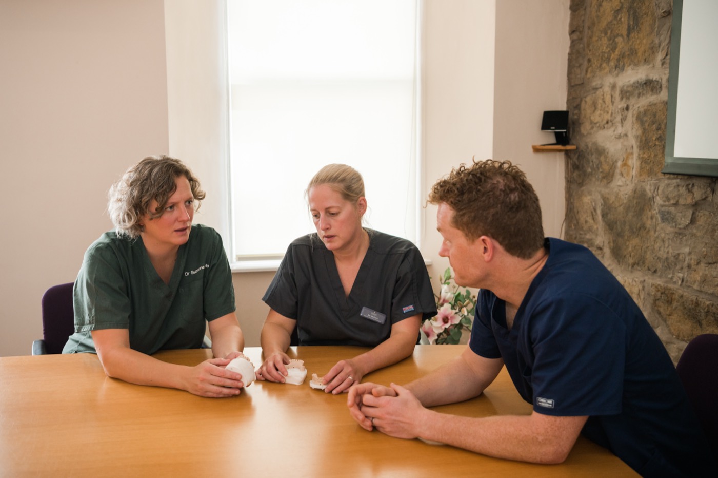 Chris planning a case with colleagues around a table