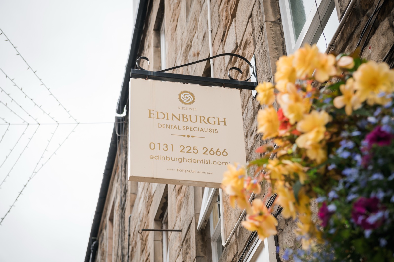 The Edinburgh Dental Specialists sign on Rose Street, with the practice phone number